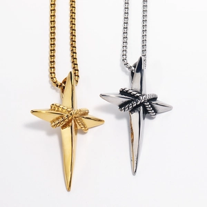 Detailed close-up of gold and silver stainless steel cross pendants with box chain necklaces