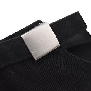 Detail of black cotton twill cap with silver metal adjustable buckle and logo