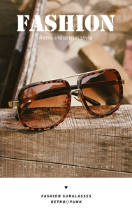 Retro tortoise shell aviator sunglasses with metal bridge on vintage wood background