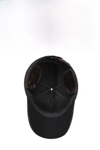 Detailed view of the warm plush lining and ear protection on this winter wool baseball cap