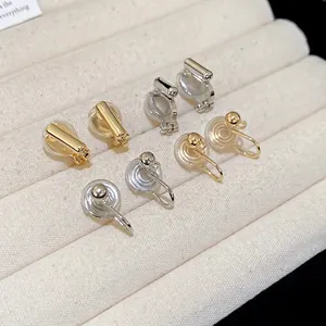 Minimalist geometric round clip-on ear converters in gold and silver with silicone pads