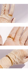 Macro view showing the polished gold ribbed texture on open snake bone ring and bracelet