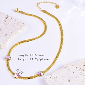 Macro shot of gold snake chain with colorful clover charms and size specifications