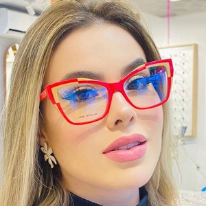 Retro cat-eye blue light blocking glasses with red and yellow two-tone frame on model