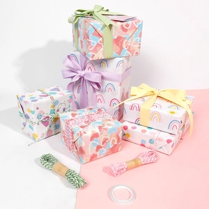 Star and heart pattern gift wrapping paper set with colorful ribbons for Valentine's Day