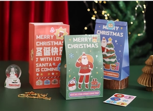 Detailed view of colorful Christmas gift bags featuring festive Santa and reindeer designs