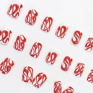 Short round press-on nails with white base and red wave patterns for Halloween