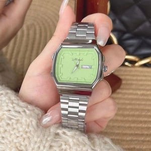 Silver steel strap watch with green square dial featuring day-date display for women
