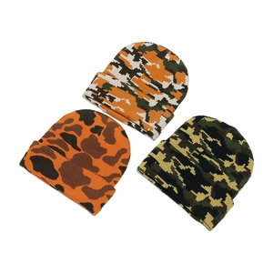 Three camouflage knit beanies in pixel and classic patterns for winter warmth