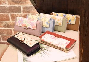 Detailed display of long PU leather floral wallets in six various vintage colors