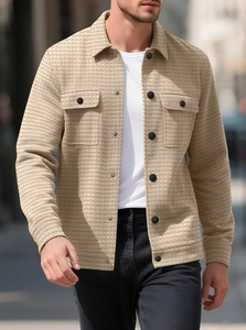 Detail of khaki waffle texture casual shirt jacket with black buttons and chest pockets