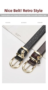 Close-up of crocodile embossed leather belt with gold pin buckle and mini lock pendant