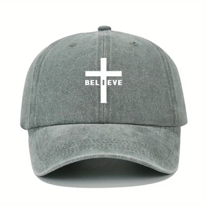 Close-up of BELIEVE cross print and reinforced stitching on gray washed cotton baseball cap