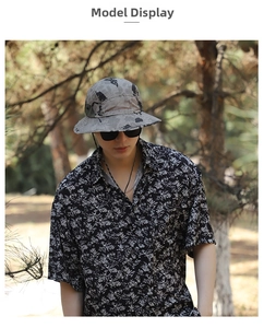 Outdoor sun hat with drawstring in gray pattern paired with floral summer shirt