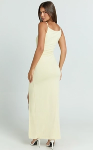 Back view of a light yellow bodycon maxi dress with thin straps and side slit details