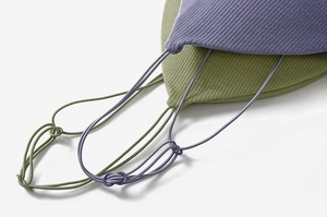 Detail view of adjustable thin straps on ribbed seamless triangle bra in purple and green