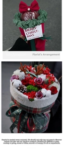Detailed view of Christmas bouquet with red roses, pine cones, and festive plaid fabric wrap