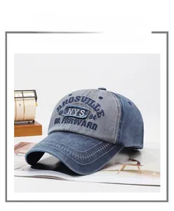 Close-up of vintage washed denim baseball cap with BROSVILLE embroidery and contrast stitching