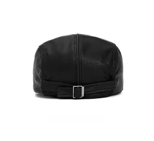 Detail view of the adjustable metal buckle on back of black leather flat cap