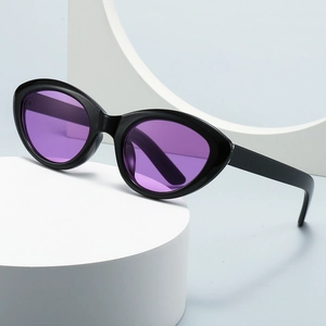Retro cat eye sunglasses with thick black resin frames and vibrant purple lenses