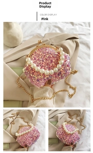 Pink sequin shell bag with pearl handle and golden chain strap in detail view