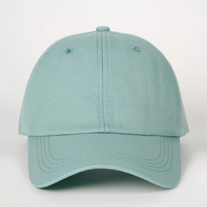 Detailed close-up of mint green cotton baseball cap with six-panel design and reinforced stitching