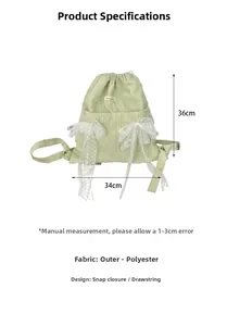 Close-up of green drawstring backpack with white lace bows and polyester texture details