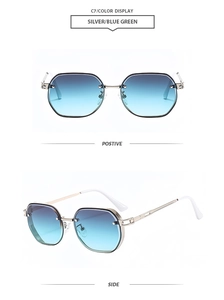 Detail view of silver metal polygon sunglasses with blue green gradient lenses