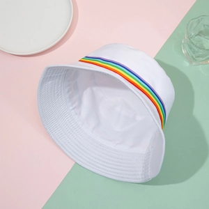 Detail of white cotton bucket hat featuring a rainbow woven band and premium inner stitching