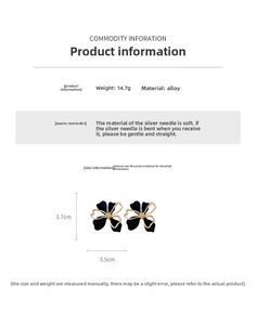 Detailed view of dual-layer flower earrings with silver needles and black petal accents