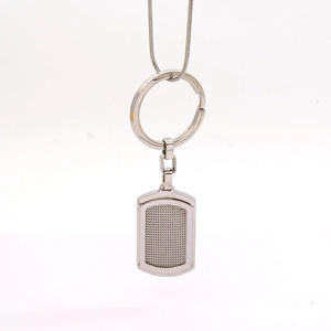 Polished silver stainless steel square dog tag keychain with textured grid pattern
