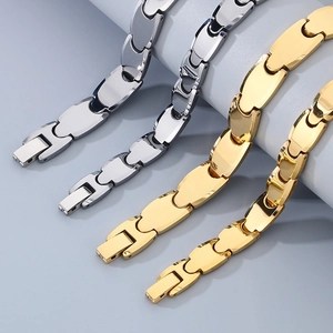 Parallel layout of gold and silver tungsten magnetic bracelets with polished link chains