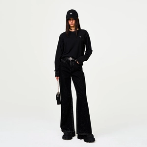 Black long sleeve cotton tee with cross embroidery and wide leg denim jeans