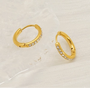 Close-up of 18K gold plated stainless steel hoop earrings with sparkling zirconia stones