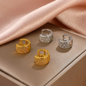 Elegant gold and silver geometric hoop earrings with sparkling pave-set white zircons