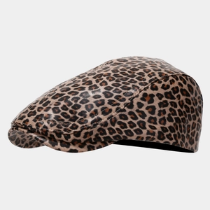 Detailed view of the leopard print PU leather flat cap with smooth glossy finish