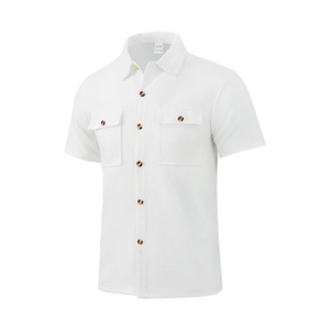 Detail of white waffle knit texture and chest pockets on short sleeve men's shirt