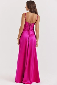 Detail of cross-back lace-up corset and satin fabric on the rose pink long evening dress
