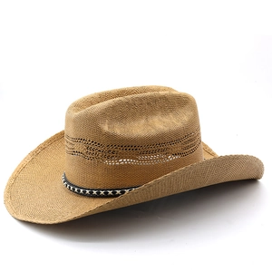 Detail of western woven straw cowboy hat with hollow breathable band and geometric trim