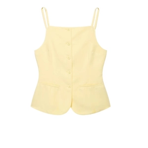 Women's pale yellow button-down camisole top and shorts set in plain white background