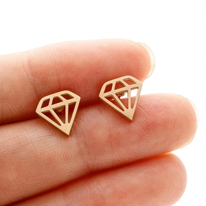 Detail of mini gold-plated diamond-shaped hollow earrings held to show scale