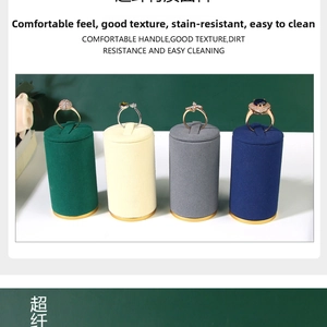 Detail of microfiber ring display stands in four colors with elegant gold metal bases
