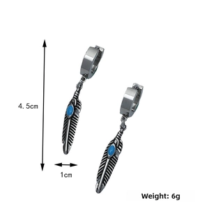 Detail of silver feather earrings with blue stones featuring size dimensions 4.5cm by 1cm