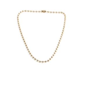 Golden bead chain necklace for women in a minimalist U-shaped arrangement on white background