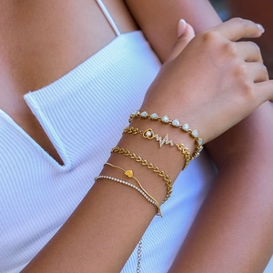 5-piece gold layered bracelet set featuring zircon hearts and heartbeat charms for women