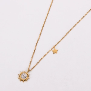 Detail of 18k gold sunflower pendant necklace with tiny star charm and white zircons