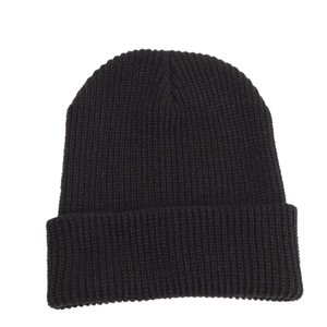 Classic black ribbed knit beanie featuring a thick cuffed brim for winter outdoor warmth