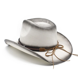 Detailed view of woven straw cowboy hat with black gradient spray and brown ribbon bow