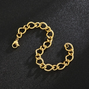 Close-up of golden 10mm twisted chain link bracelet with lobster clasp on dark texture