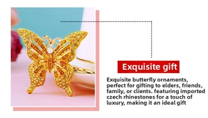 Detailed view of butterfly keychain with yellow Czech rhinestones and gold plating